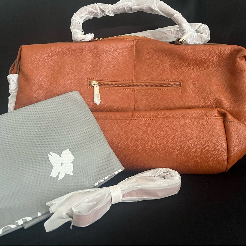 Ora Delphine tan leather tote bag.